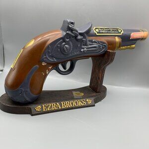 Collectible Ezra Brooks Pistol Shaped Whiskey Bottle on Display Stand (Empty)